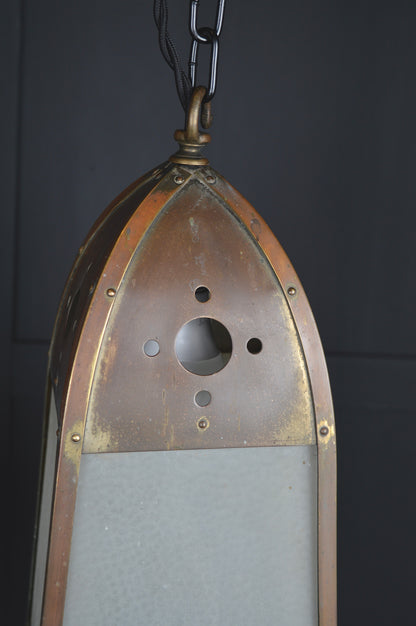 Pair of gothic revival glazed brass lights