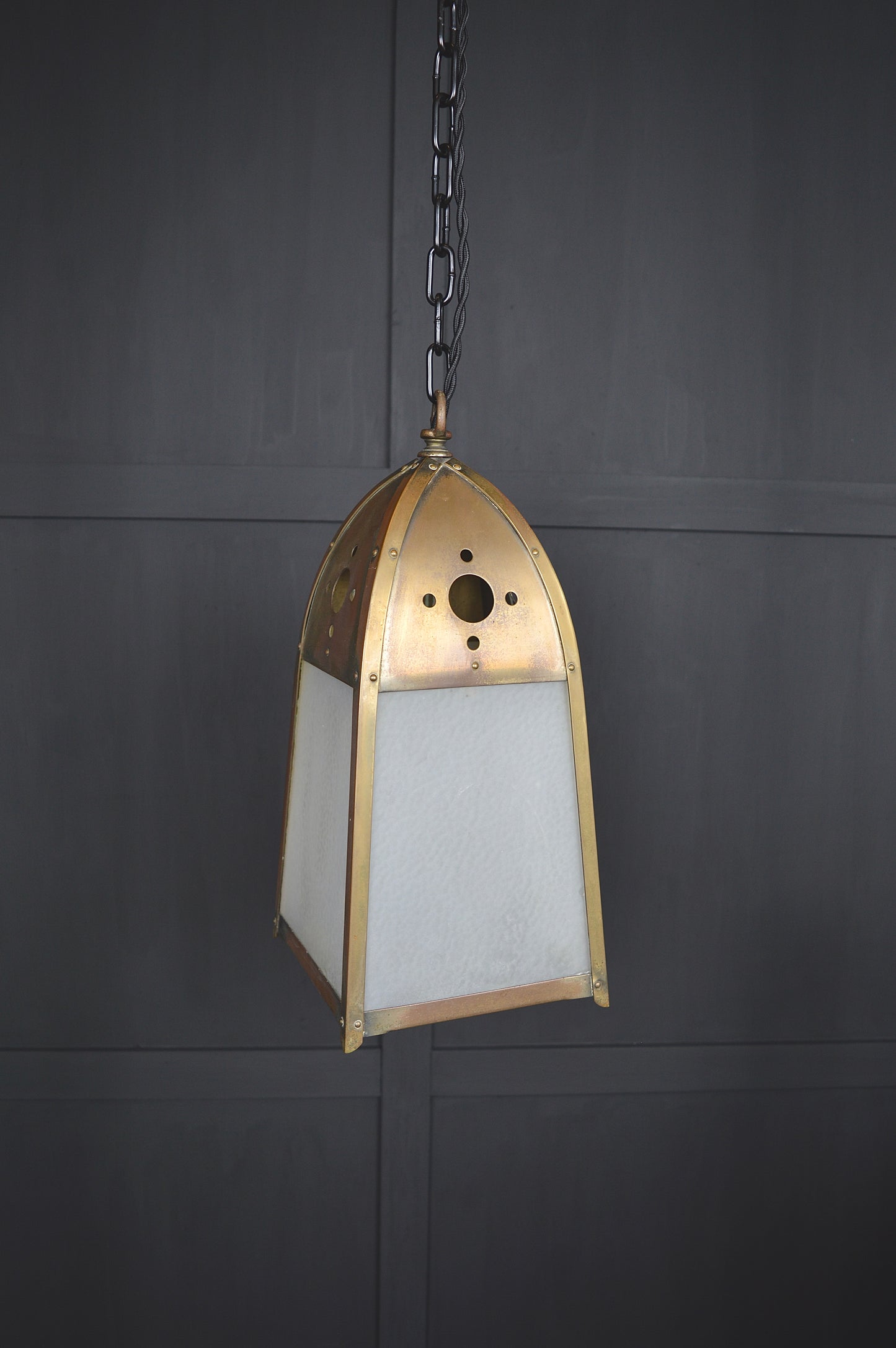 Pair of gothic revival glazed brass lights