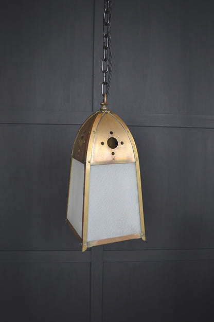 Pair of gothic revival glazed brass lights
