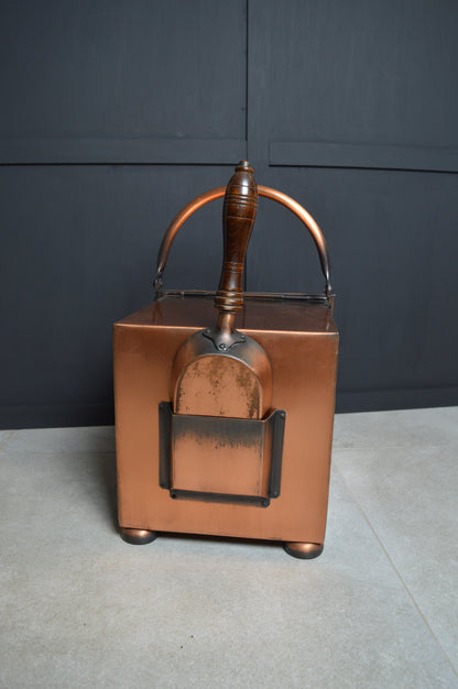 Vintage copper coal scuttle bucket with wooden handle and matching shovel, antique decor