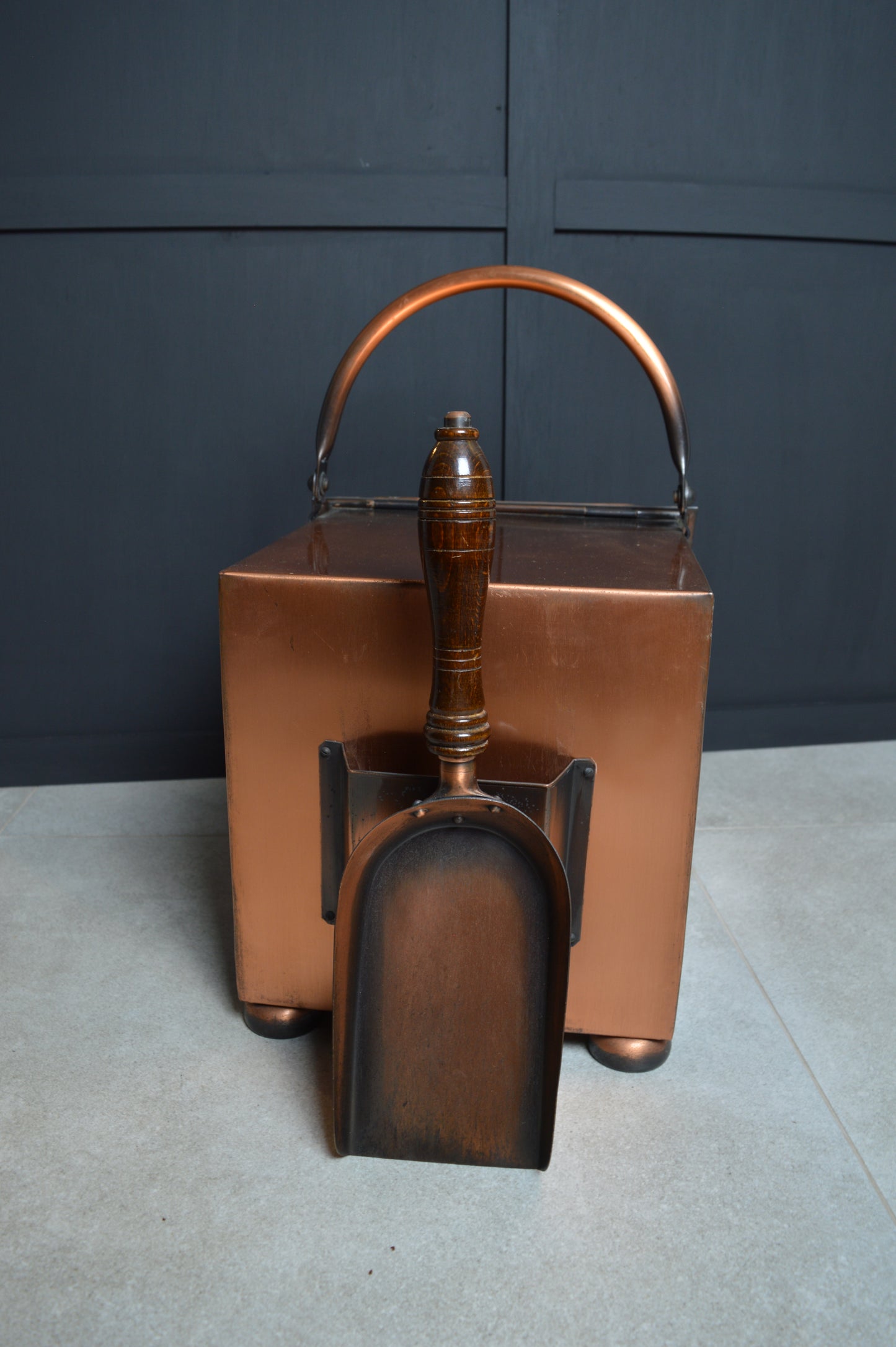 Vintage copper coal scuttle with wooden handled shovel for home fireplace decor