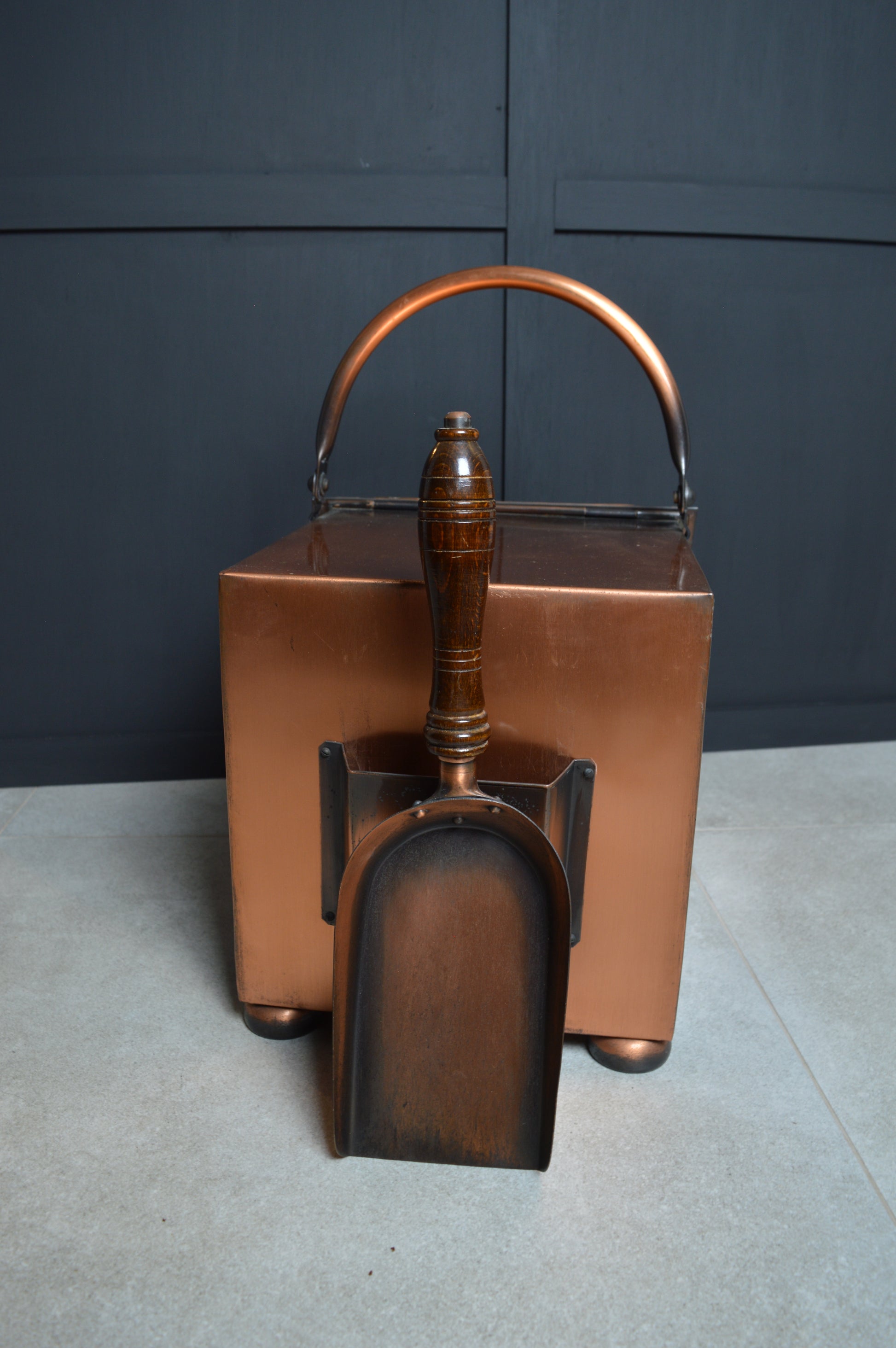 Vintage copper coal scuttle with wooden handled shovel for home fireplace decor